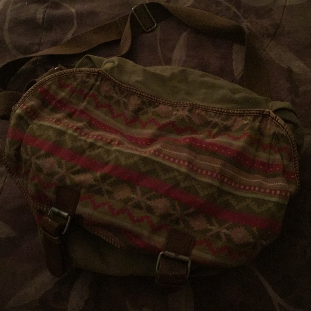 Tan, light brown bag with pink on the front